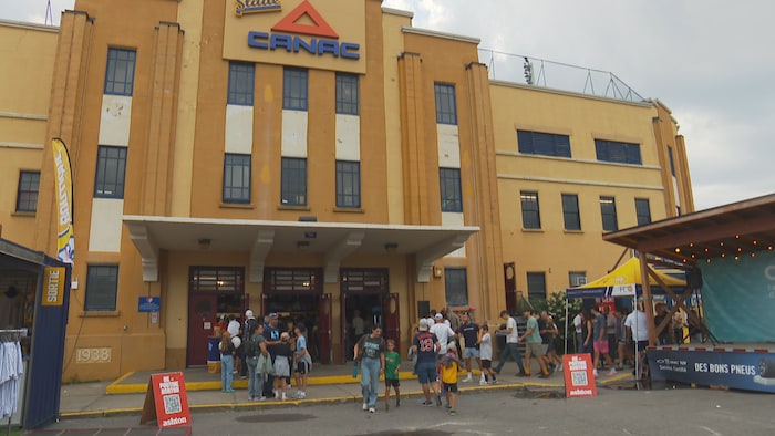 People enter the Canac stadium.
