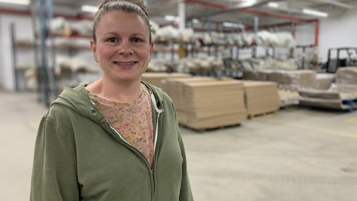 Stephanie Bevan wears sweater.