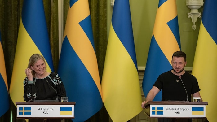 Swedish Prime Minister Magdalena Andersson and Ukrainian President Volodymyr Zelensky are seen during a joint news conference on Monday in Kyiv, Ukraine. Russia's invasion of Ukraine has spurred Sweden, along with Finland, to seek membership in the NATO military alliance after decades of neutrality. 