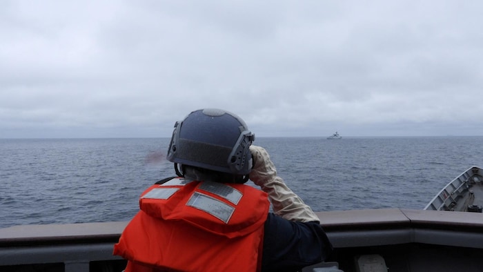 A Taiwanese sailor looks out to sea.