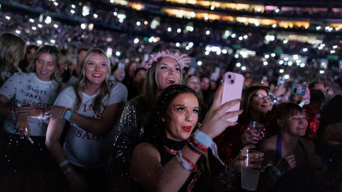 Swifties watch the pop superstar kick off the first show of her six-night stop in Toronto with the song Miss Americana & the Heartbreak Prince. 