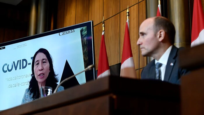 Health Minister Jean-Yves Duclos, right and Canada's top doctor Theresa Tam everyone eligible for a booster dose should get their third shot now before the new, more infectious Omicron variants take hold in the coming weeks.