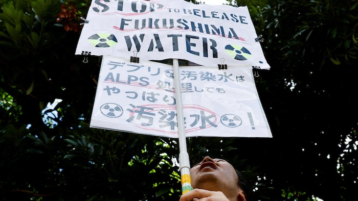 A protester holds a banner.