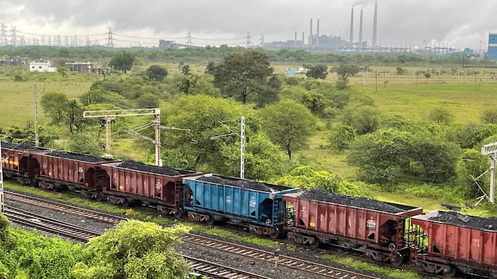 A train loaded with coal rolls through Chandrapur. Indian Railways receives nearly half of its revenue from moving coal across the country, charging more for that service in order to subsidize cheaper fares for passengers, which makes rail travel across the vast nation more accessible to some of the country's poorest.