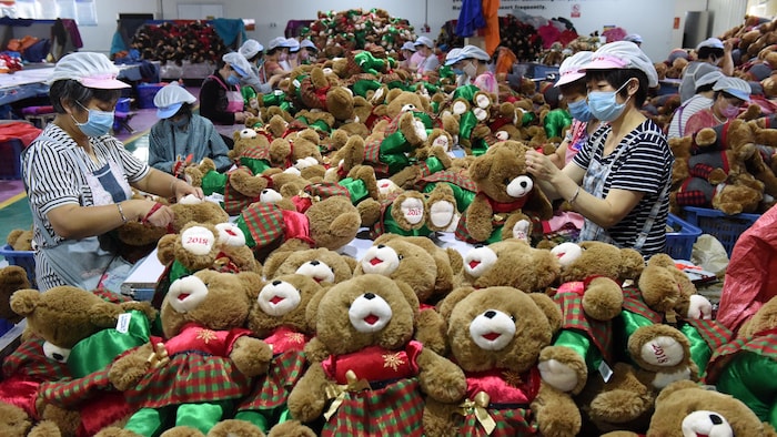 Employees make stuffed animals in a lilyi factory in Shandong province.