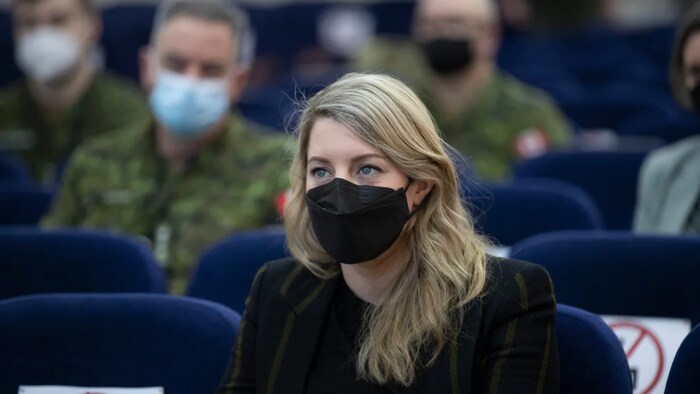 In this photo provided by Ukrainian National Guard Press Office, Foreign Affairs Minister Melanie Joly listens to a Canadian instructor's report during her visit to the National Guard base close to Kyiv, Ukraine on Tuesday, Jan. 18, 2022.
