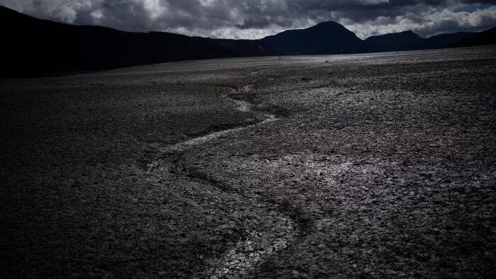 A usually submerged section of the lake Serre-Poncon is dry in southern France, on March 14, 2023. A new UN climate report is probably the last before the world hits 1.5 C of warming. (Daniel Cole/The Associated Press)