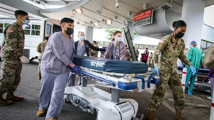 Soldiers, airmen and civilian staff at Landstuhl Regional Medical Center, Germany, receive injured who were medically evacuated from Kabul, Afghanistan on Friday, Aug. 27, 2021. They were wounded in the bombing outside of Hamid Karzai International Airport in Kabul on Aug. 26.