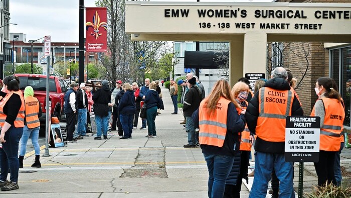 Google says it will automatically delete location history data showing visits to abortion clinics, among other locations, around the world. In this photo, anti-abortion protesters, left, and clinic escorts gather outside an abortion clinic in Louisville, Ky., on April 16.