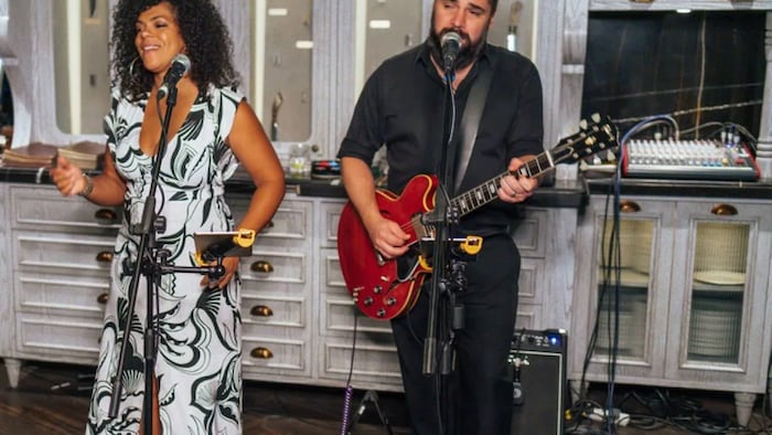 Janelle Thomas, 43, is a singer originally from Victoriaville, Que., who now works in UAE. She says Ottawa’s approach of excluding vaccines that haven't been approved in Canada is alienating Canadians overseas. In this photo, Thomas and her husband Félix perform at the Weslodge Saloon in Dubai.