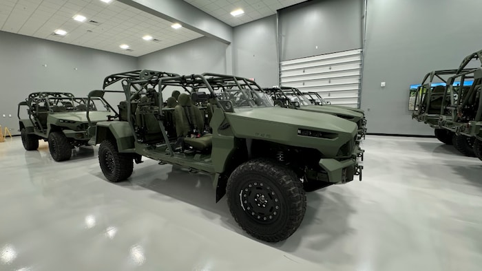 The four main components to strengthen the Canadian economy star-news.press/wp Green vehicles roofing or doors hanging in a hangar with gray gray and white floors.