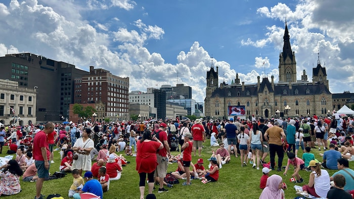 Visitors on the hill of the Parliament. canada day marked "canadian pride"