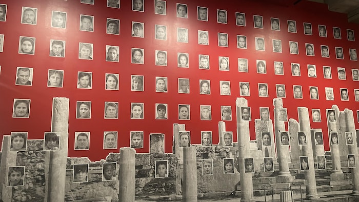 A huge mural containing dozens of black and white photos. 