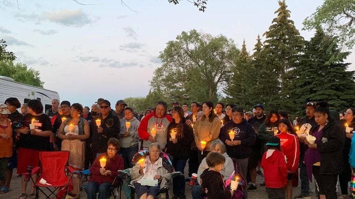 Dozens of people gathered at Chef Whitecap Park near Saskatoon for a candlelight vigil in support of Dawn Walker and her son, when the mother-son duo was still considered missing. (Yasmine Ghania/CBC)