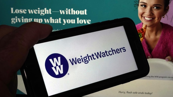 Le logo de WeightWatchers sur un téléphone portable.