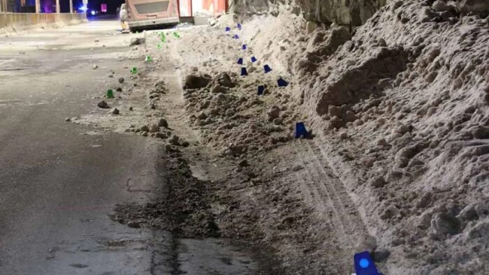 This police photo from the scene of the 2019 crash shows tire marks left by the double-decker bus along the icy shoulder before it struck the bus shelter.