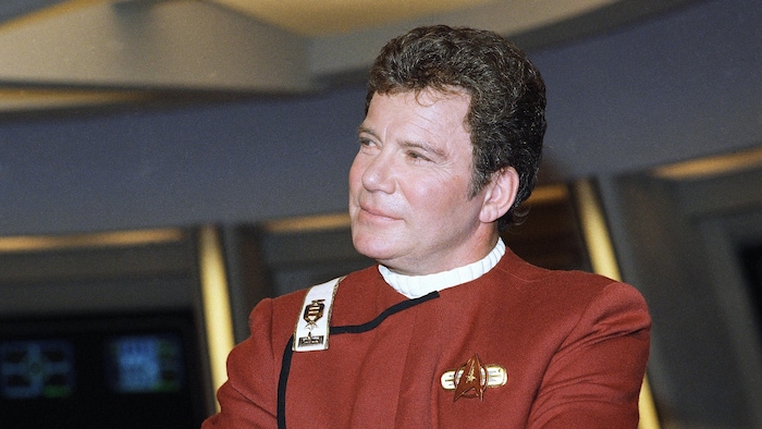 William Shatner takes on a pensive pose and is dressed in his costume by Captain Kirk. william shatner back his natal new
