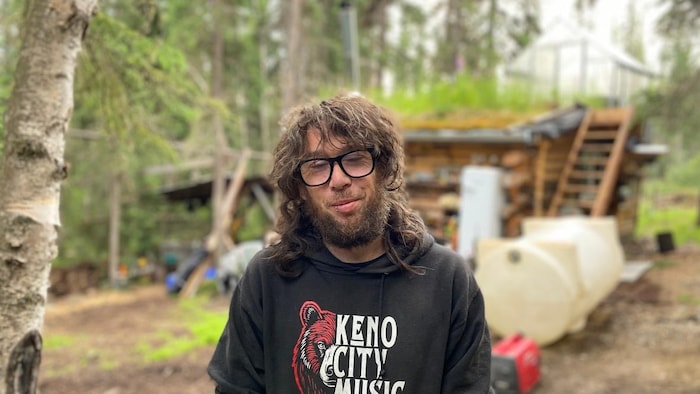 Portrait of Cud Eastbound in front of his log cabin on June 25, 2025. fight against forest fires strengthened