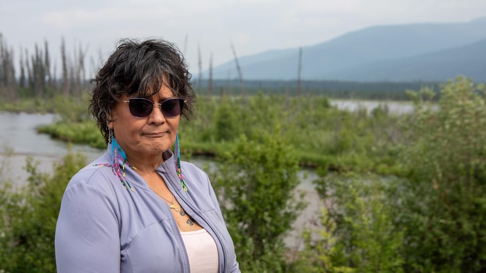 Dawna Hope in front of a Yukon stream.