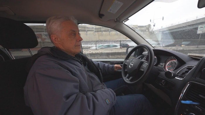 Yves Désautels at the wheel of his vehicle.