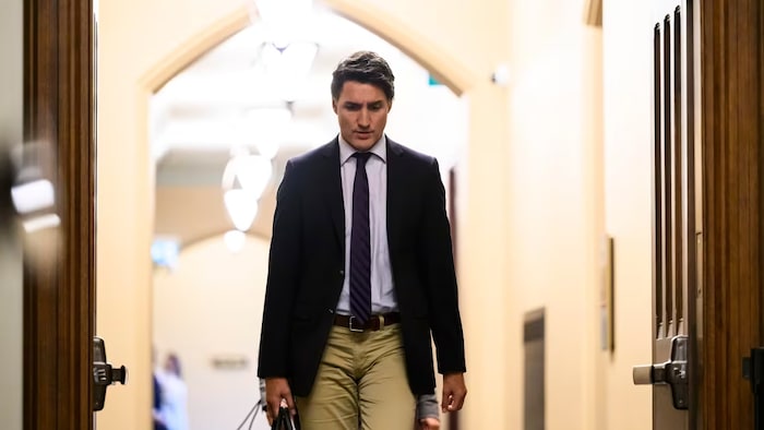 Prime Minister Justin Trudeau walks to make a statement to reporters after Rota, not shown, accepted responsibility for honouring a man who fought with a Nazi unit during a recent Parliamentary address from the Ukrainian president. (Justin Tang/The Canadian Press)