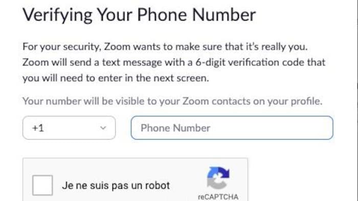 Capture d'écran d'une fenêtre sur le site web de Zoom qui demande à l'internaute de valider son numéro de téléphone afin de vérifier qu'il ne s'agit pas, entre autres, d'un robot. 