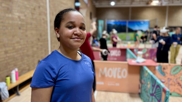Awa Morindiouf is in a school gymnasium during an interview with Radio-Canada.