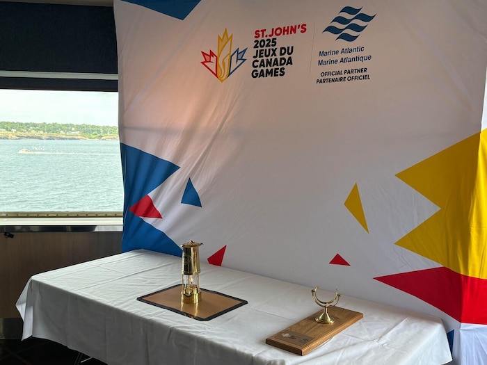 A lantern on a table in a boat. canada 2025's flame summer games canada 2025's flame summer games new