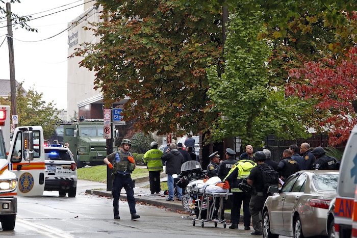 First responders surround the Tree of Life Synagogue in Pittsburgh, Pa., where a shooter opened fire Saturday, Oct. 27, 2018. (AP Photo/Gene J. Puskar)