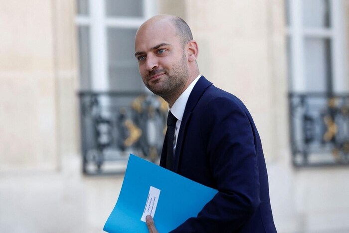 A man holding a folder.