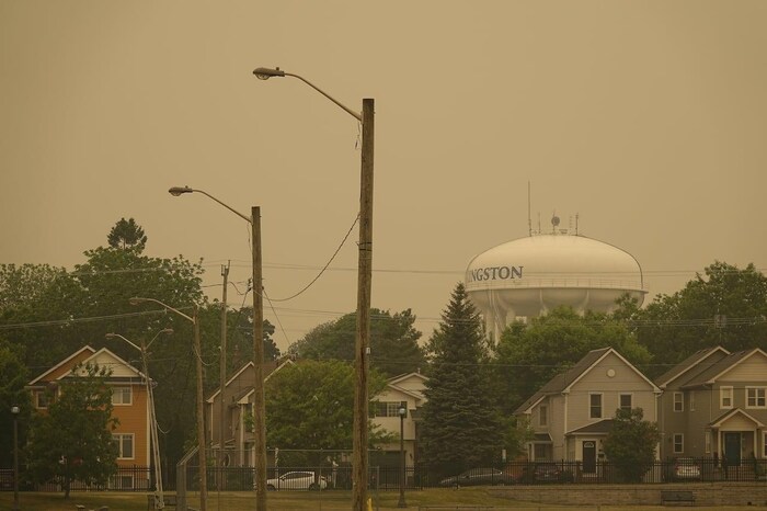 Wildfire smoke blankets Kingston, Ont., Tuesday. Experts advise closing windows and other passageways for smoke to get inside your home during periods of poor air quality and airing out your home properly once the smoke clears.