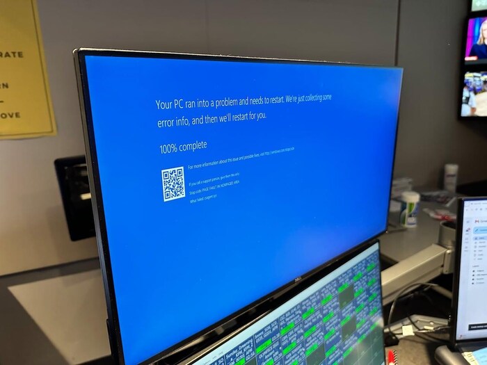 A blue error screen is seen on a computer.