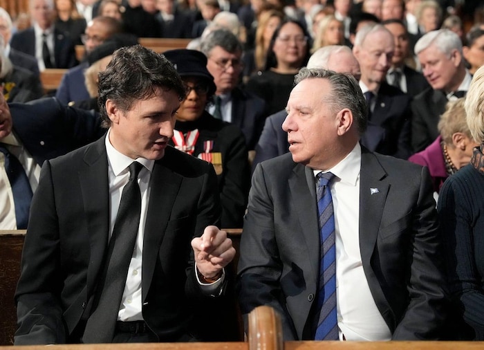 Prime Minister Justin Trudeau and Quebec Premier Francois Legault chat at the funeral of former prime minister Brian Mulroney in Montreal on March 23, 2024.