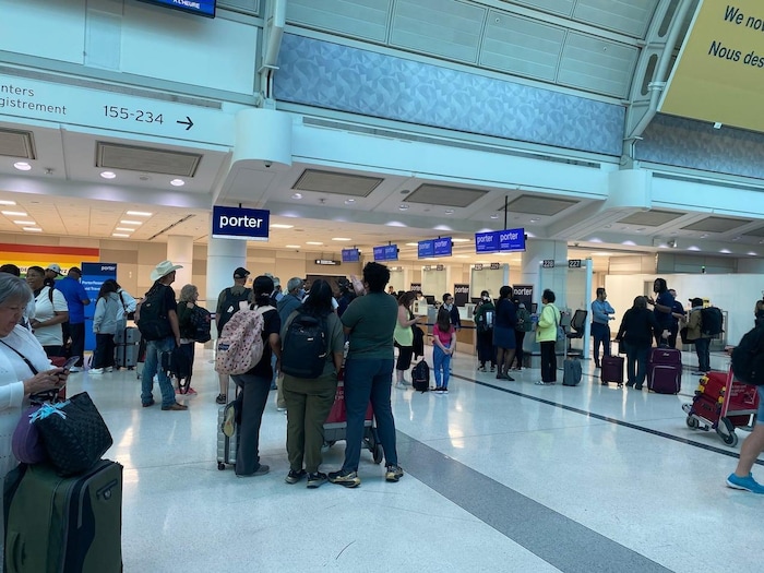 People are standing around in an airport.