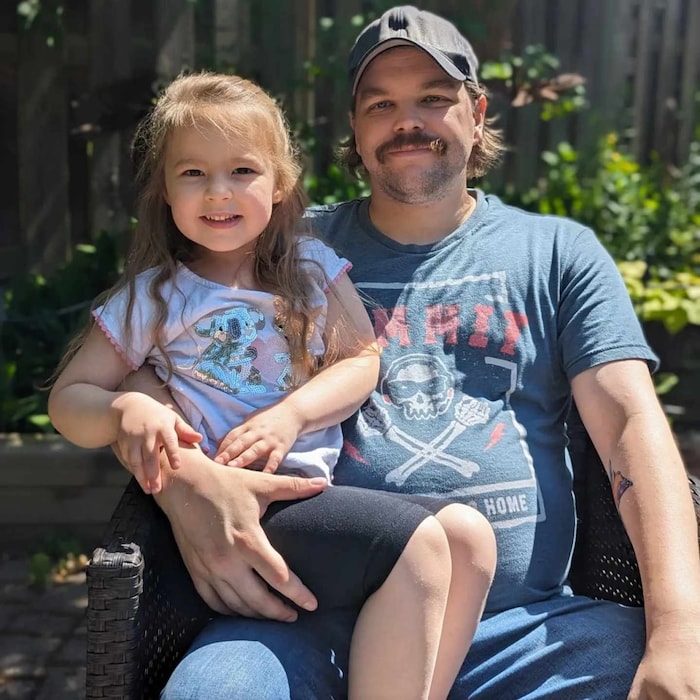 Zach Robichaud, right, of Kitchener, Ont., poses with his daughter, Avery. Robichaud would have liked to have a big family, but says he can't afford more than one child when most of his income goes to rent. 