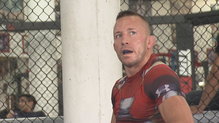 Georges St-Pierre in a training cage.