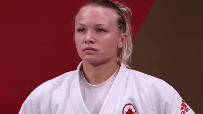 Close-up of a ‍judoka in white.