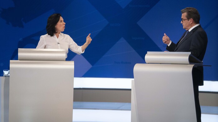 Denis Coderre et Valérie Plante débattent.