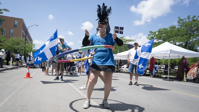 A woman dances with a hoop. Consequently, saint-jean-baptiste: montreal fleurdelisé overwhelming heat saint-jean-baptiste: montreal fleurdelisé overwhelming heat new