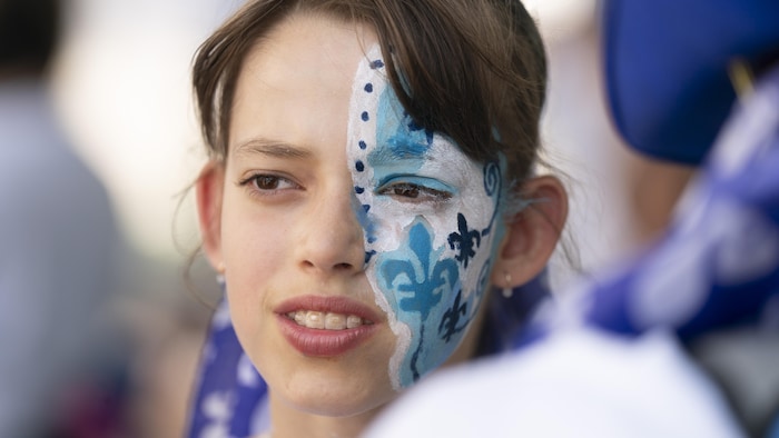 A young girl with a fleur -de -lis makeup. Consequently, saint-jean-baptiste: montreal fleurdelisé overwhelming heat saint-jean-baptiste: montreal fleurdelisé overwhelming heat new