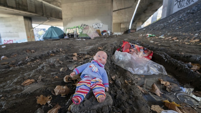 A Doll And Tents Under The Highway Structure.