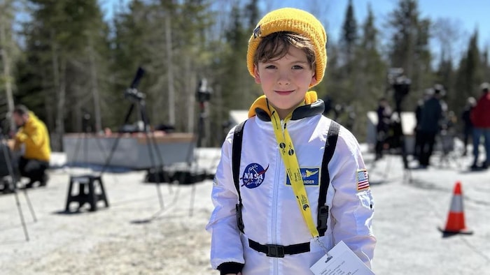 A little boy dressed as an astronaut.