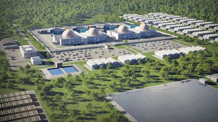 Représentation visuelle de la centrale nucléaire avec de nombreux bâtiments qui entourent quatre réacteurs nucléaires au centre de la représentation.