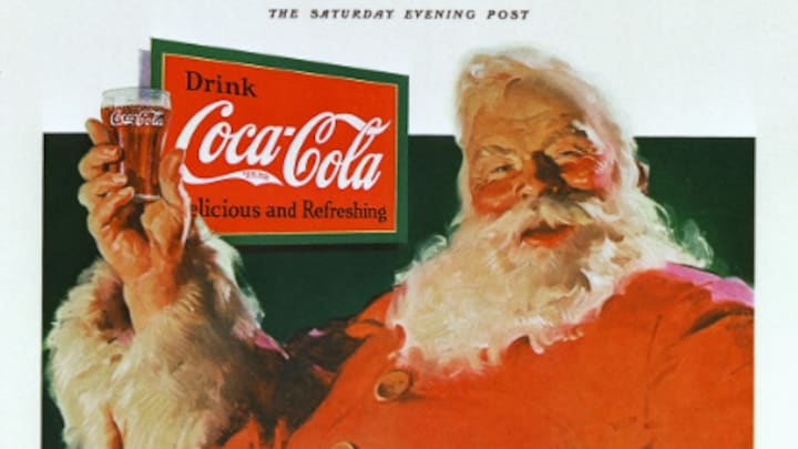 Une publicité peinte à l'huile où le père Noël tient un verre de Coca-Cola.