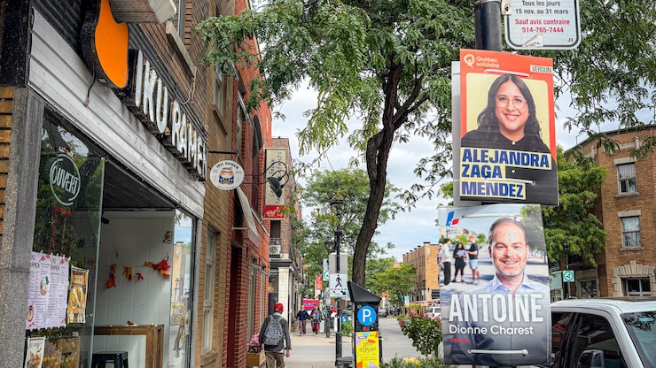 Une rue de Verdun avec des pancartes électorales.