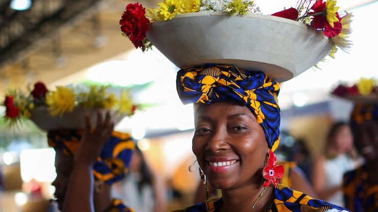 An indigenous Afro-Colombian woman poses for a photo as she waits to participate in the opening event of the 16th United Nations Biodiversity Summit (COP16) in Cali, Colombia October 20, 2024. REUTERS/Juan David Duque
