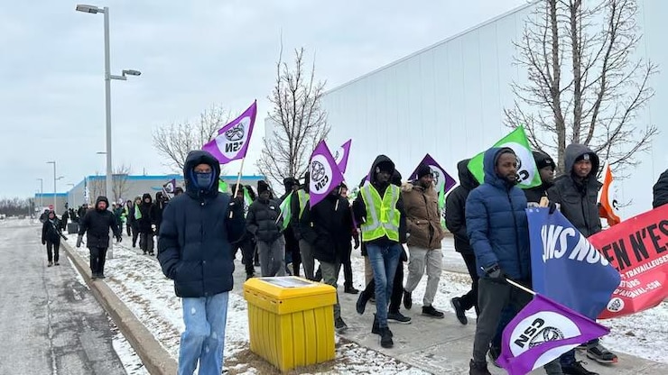 Dozens of unionized Amazon employees in Laval, Que., participated in a demonstration of solidarity Monday as talks continue between CSN and the company for the first collective agreement.