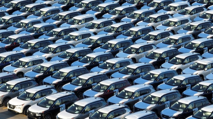 New Nissan cars are parked in rows after arriving by ship at Annacis Island in Delta, B.C., in 2023. Nissan has years of experience building batteries and electric vehicles, and gas-electric hybrid powertrains that could help Honda in developing its own EVs and next generation of hybrids, said Sam Fiorani, vice president of AutoForecast Solutions.