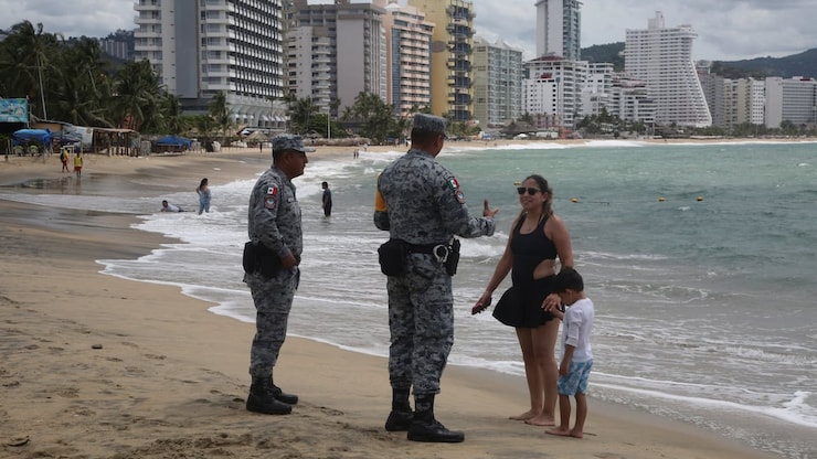 Mexican National Guard members on Tuesday warned beachgoers and tourists in Acapulco, Mexico, of the potential dangerous effects from Polo.