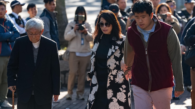 Retired Chinese cardinal Joseph Zen Ze-Kiun, from left, Jimmy Lai's wife Teresa Lai and Jimmy Lai's son Augustin Lai arrive at the West Kowloon Magistrates' Courts ahead of the verdict for Hong Kong activist publisher Jimmy Lai's national security trial in Hong Kong, Monday, Dec. 15, 2025. (AP Photo/Chan Long Hei)